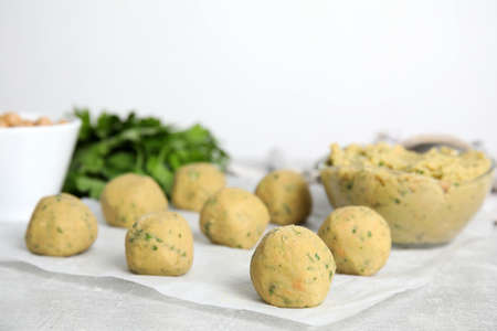 Raw falafel balls on gray table, space for textの写真素材