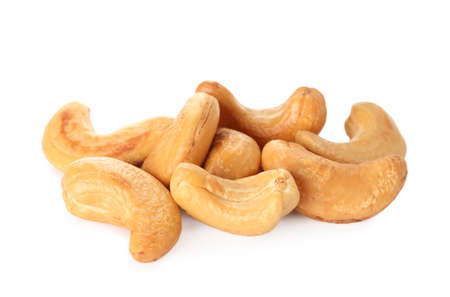 Pile of tasty organic cashew nuts isolated on whiteの写真素材