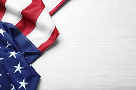 National flag of America and space for text on white wooden table, top viewの写真素材