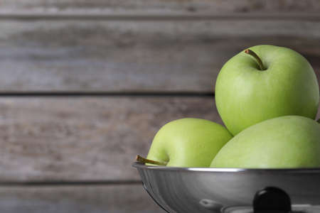 Ripe green apples on wooden background, closeup. Space for textの写真素材