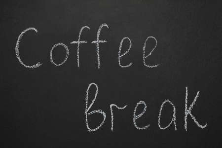 Phrase Coffee Break written with chalk on blackboardの写真素材