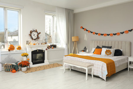 Modern bedroom decorated for Halloween. Festive interiorの写真素材