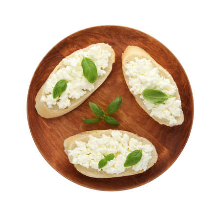 Bread with cottage cheese and basil isolated on white, top viewの写真素材