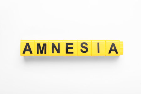 Yellow cubes with word Amnesia on white background, top view