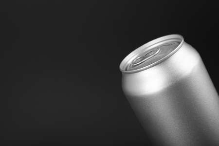 Can of energy drink on black background, closeup. Space for text