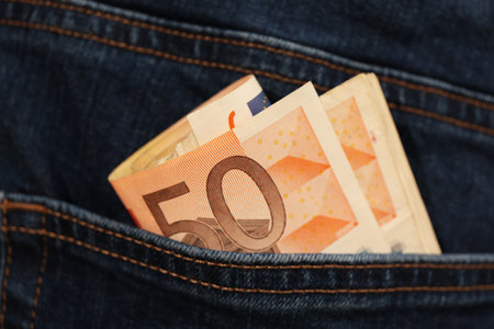 Euro banknotes in pocket of jeans, closeup. Spending moneyの写真素材