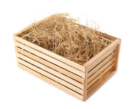 Dried hay in wooden crate on white backgroundの写真素材