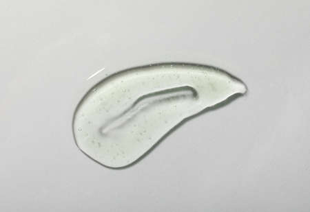 Sample of cosmetic gel on white background, top view