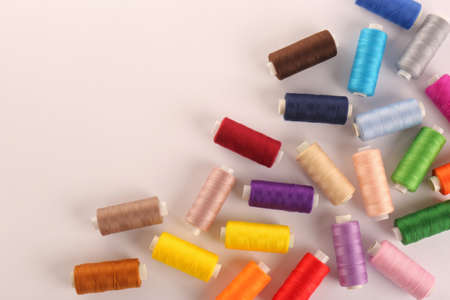 Set of colorful sewing threads on white background, top viewの写真素材