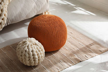 Stylish comfortable poufs in room, space for textの写真素材