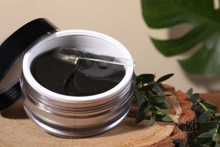 Package of under eye patches on stump. Cosmetic product, closeupの写真素材