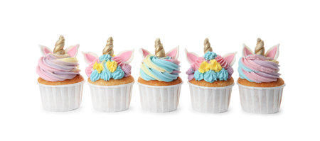 Many cute sweet unicorn cupcakes on white backgroundの写真素材