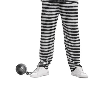 Prisoner in special uniform with metal ball on white background, closeupの写真素材