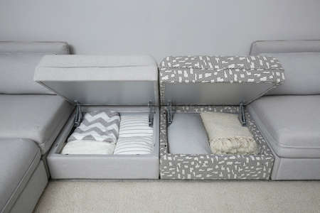 Modular sofa with storage near wall in living room. Interior designの写真素材