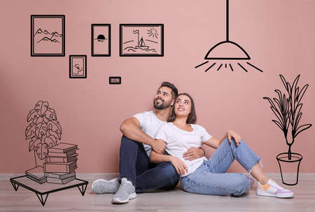 Happy couple dreaming about renovation on floor. Illustrated interior designの写真素材