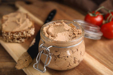 Delicious meat pate with knife on wooden table, closeupの写真素材