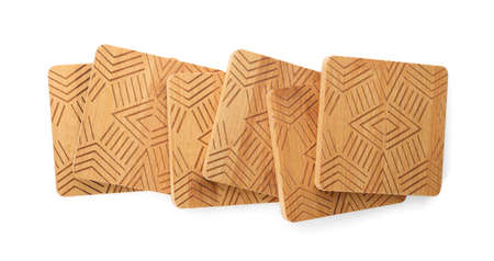 Wooden cup coasters on white background, top view