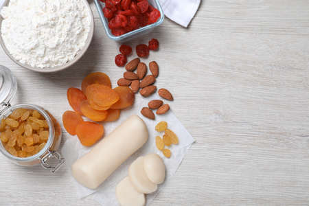 Ingredients for homemade Stollen on white wooden table, flat lay. Baking traditional German Christmas breadの写真素材