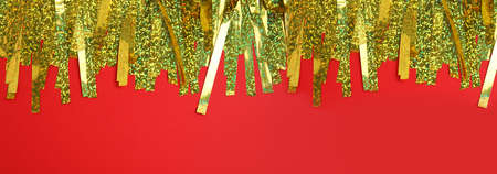 Golden tinsel on red background, top view. Banner designの写真素材