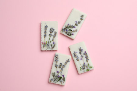 Beautiful scented sachets with flowers on pink backgroundの写真素材