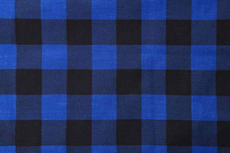 Top view of blue bandana with check pattern as backgroundの写真素材