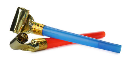 Bright party blowers on white background. Festive itemsの写真素材