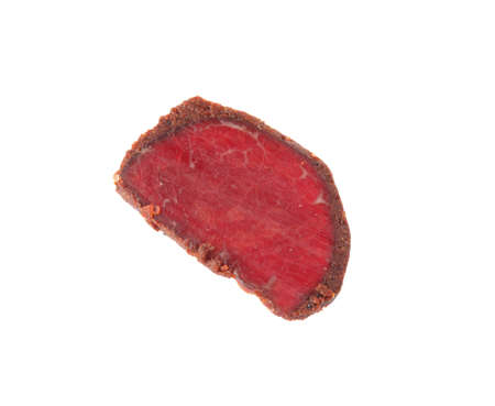 Delicious dry-cured beef basturma slice isolated on white