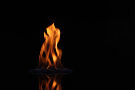 Beautiful view of flaming vodka on black backgroundの写真素材
