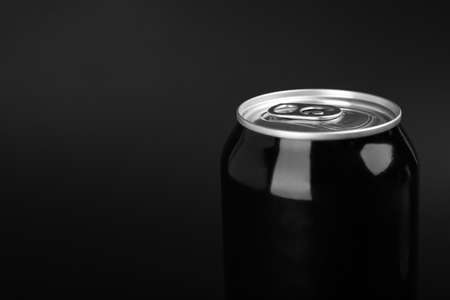 Can of energy drink on black background, closeup. Space for textの写真素材