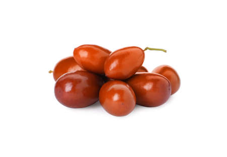 Heap of ripe red dates on white background