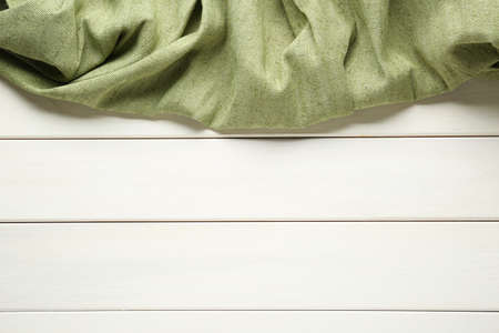 Natural burlap fabric on white wooden table, top view. Space for textの写真素材