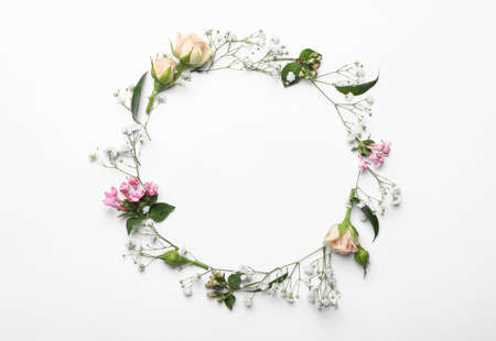 Frame made of beautiful gypsophila and other flowers on white background, top view. Space for textの写真素材