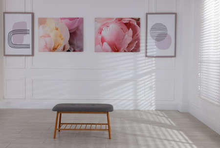 Bench and beautiful paintings in art gallery