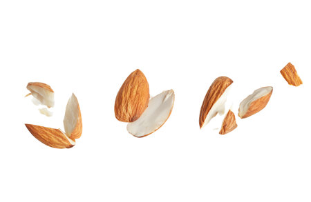 Pieces of tasty almonds on white backgroundの写真素材