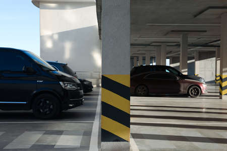 Outdoor parking lot with cars on sunny day