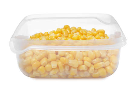 Fresh corn kernels in plastic container isolated on whiteの写真素材