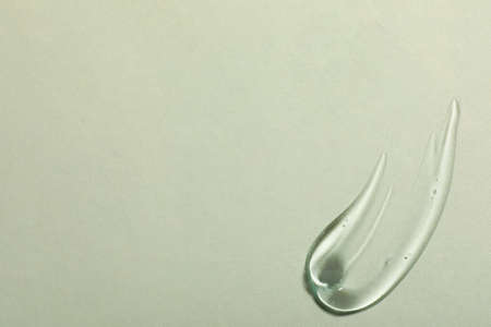 Sample of cosmetic gel on light background, top view. Space for textの写真素材