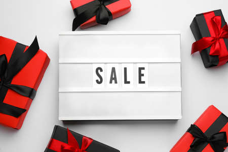 Light box with word Sale and gifts on white background, top viewの写真素材