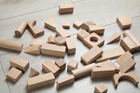 Wooden building blocks set on floor. Child's toyの写真素材