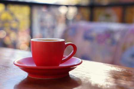 Cup of hot aromatic coffee on table in outdoor cafe. Space for textの写真素材