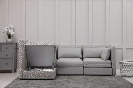 Modular sofa in living room, open section with storage. Interior designの写真素材
