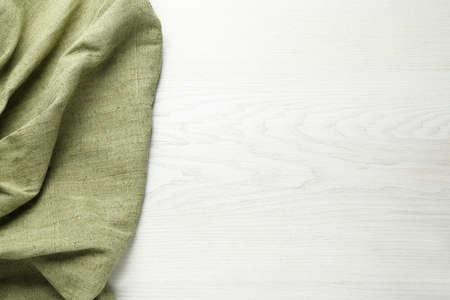 Natural burlap fabric on white wooden table, top view. Space for textの写真素材