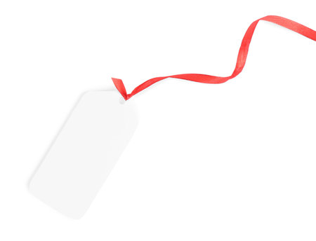 Blank gift tag with red satin ribbon on white background, top viewの写真素材