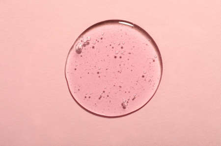 Sample of cosmetic gel on pink background, top view