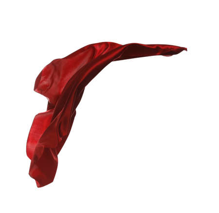 Beautiful delicate red silk floating on white backgroundの写真素材