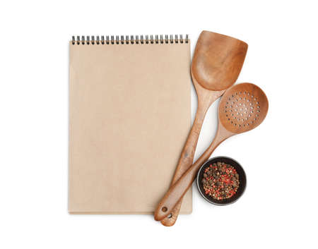 Blank recipe book, spices and wooden utensils on white background, top view. Space for text