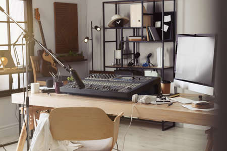 Professional audio equipment in modern radio studio