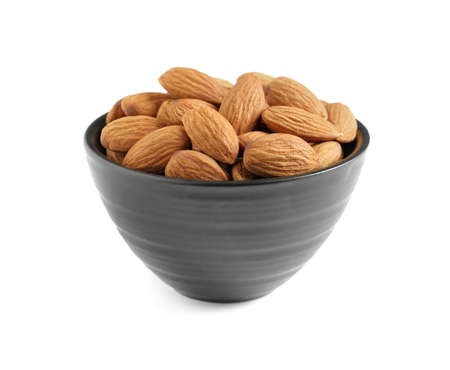 Bowl with organic almond nuts on white background. Healthy snackの写真素材
