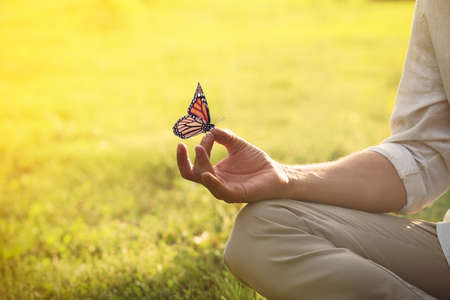 Man meditating outdoors on sunny day, closeup. Space for textの写真素材