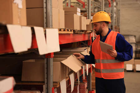 Man with tablet working at warehouse. Logistics centerの写真素材